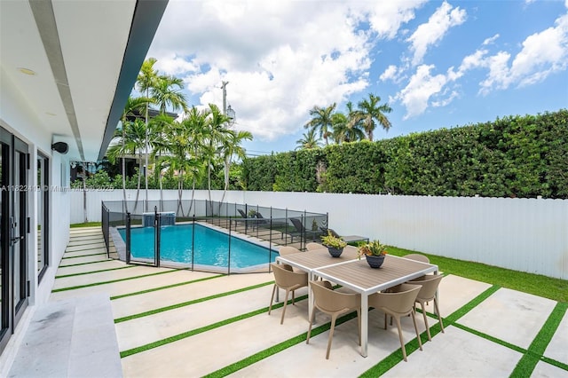 1331 97th St, Bay Harbor Islands, FL 33154 - view of swimming pool featuring a patio, a fenced backyard, and outdoor dining area
