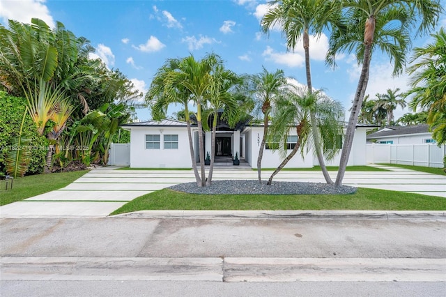 1331 97th St, Bay Harbor Islands, FL 33154 - view of front of home with driveway and stucco siding