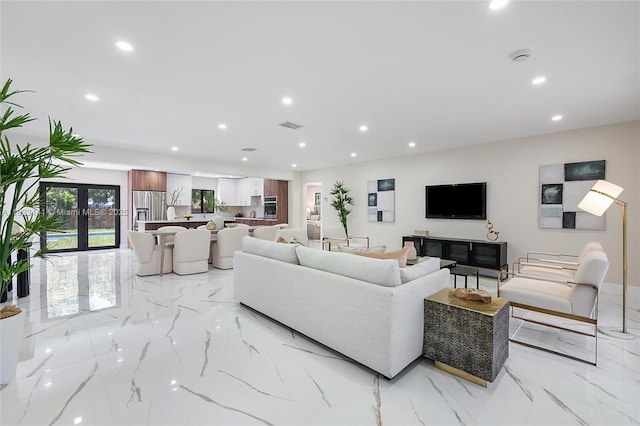 4300 Monroe St, Hollywood, FL 33021 - living room with light marble finish flooring, recessed lighting, and french doors