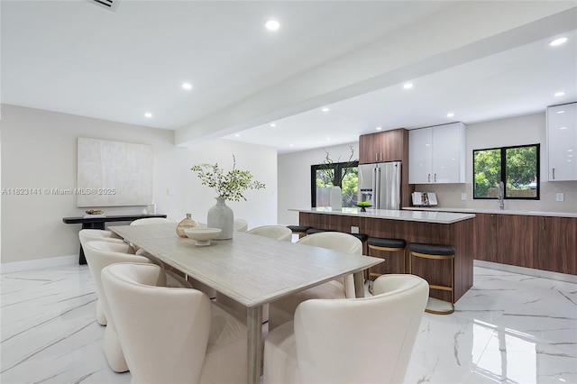 4300 Monroe St, Hollywood, FL 33021 - dining area with light marble finish flooring, recessed lighting, and beam ceiling