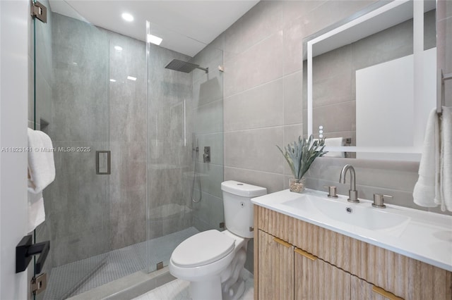 4300 Monroe St, Hollywood, FL 33021 - full bath featuring tile walls, vanity, a shower stall, and tile patterned flooring