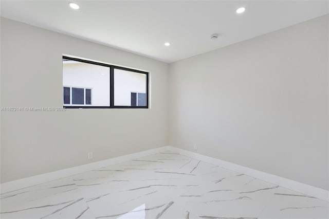 4300 Monroe St, Hollywood, FL 33021 - unfurnished room featuring recessed lighting, marble look tile flooring, and a smoke detector