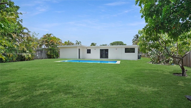 4300 Monroe St, Hollywood, FL 33021 - rear view of house featuring stucco siding and a fenced backyard