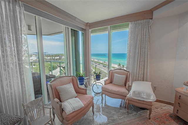 6051 N Ocean Dr Unit 704, Hollywood, FL 33019 - sunroom featuring healthy amount of natural light and a water view