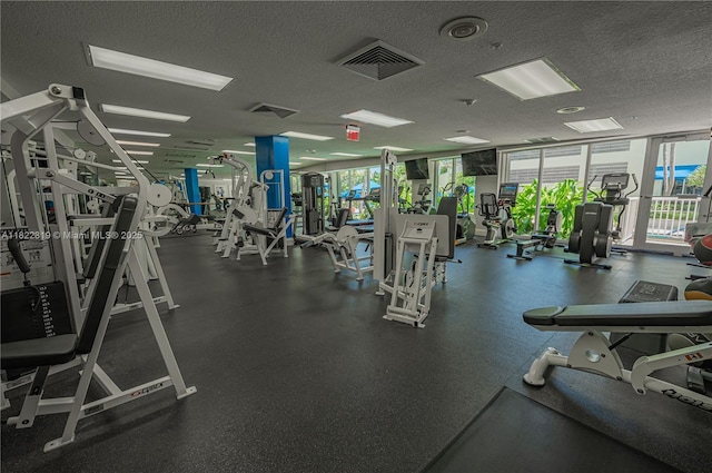 6051 N Ocean Dr Unit 704, Hollywood, FL 33019 - workout area featuring a textured ceiling