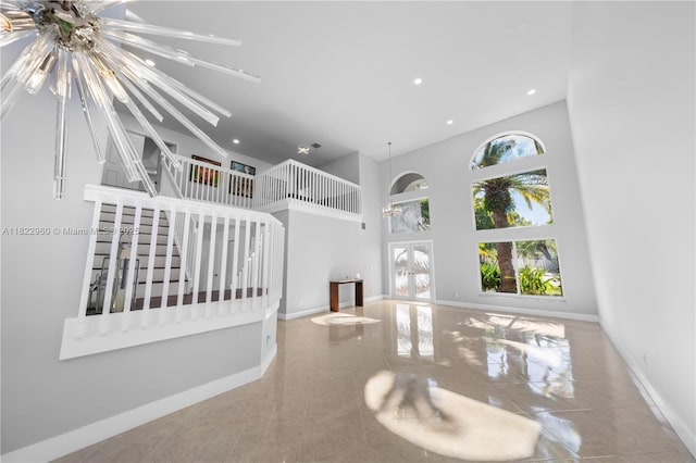 2631 SW 180th Ave, Miramar, FL 33029 - unfurnished living room featuring a high ceiling, recessed lighting, and tile patterned floors