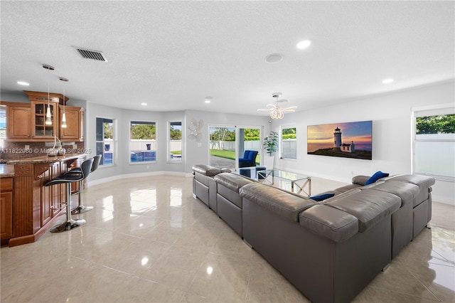 2631 SW 180th Ave, Miramar, FL 33029 - living room featuring recessed lighting, light tile patterned floors, and a textured ceiling