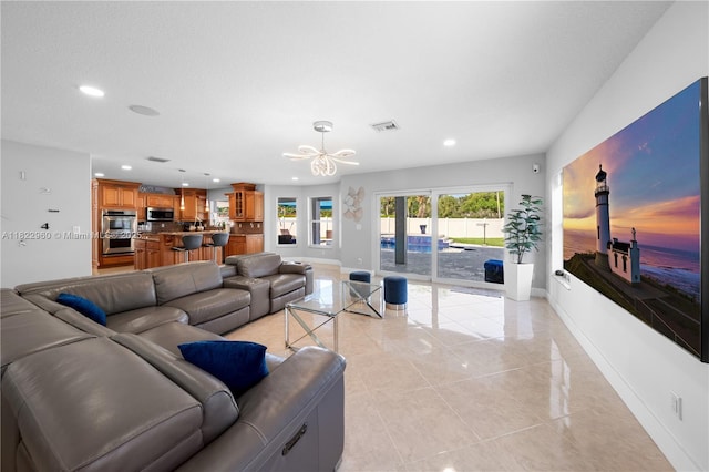 2631 SW 180th Ave, Miramar, FL 33029 - living area featuring a chandelier, recessed lighting, and light tile patterned floors