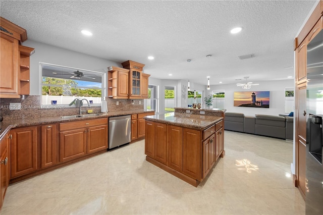 2631 SW 180th Ave, Miramar, FL 33029 - kitchen featuring stainless steel dishwasher, open shelves, a ceiling fan, brown cabinetry, and a textured ceiling