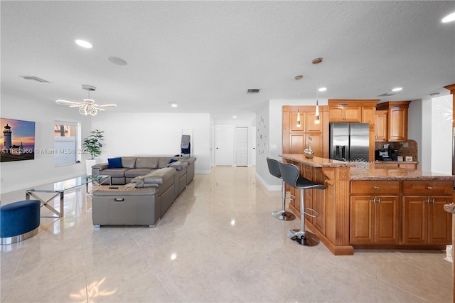 2631 SW 180th Ave, Miramar, FL 33029 - living room with recessed lighting, a ceiling fan, a textured ceiling, and light tile patterned floors