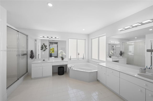 2631 SW 180th Ave, Miramar, FL 33029 - full bath with a stall shower, two vanities, a bath, tile patterned flooring, and recessed lighting