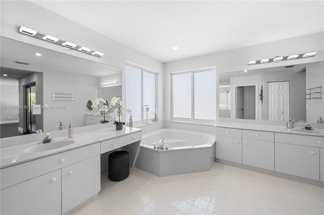 2631 SW 180th Ave, Miramar, FL 33029 - full bath with two vanities, a garden tub, and recessed lighting