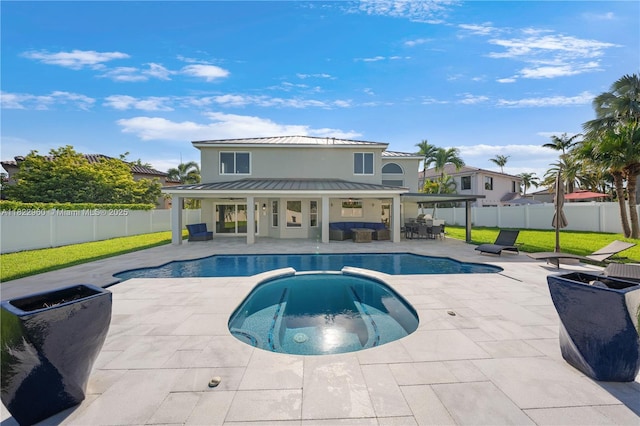 2631 SW 180th Ave, Miramar, FL 33029 - view of pool featuring a fenced backyard, an outdoor living space, a patio area, and a pool with connected hot tub