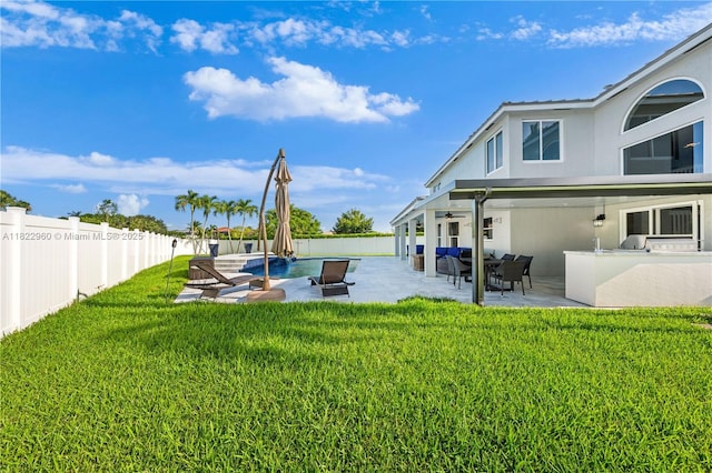 2631 SW 180th Ave, Miramar, FL 33029 - fenced backyard with an outdoor kitchen, a ceiling fan, and a patio