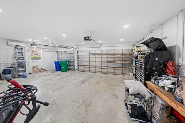 2631 SW 180th Ave, Miramar, FL 33029 - garage featuring a wall unit AC, a garage door opener, and recessed lighting