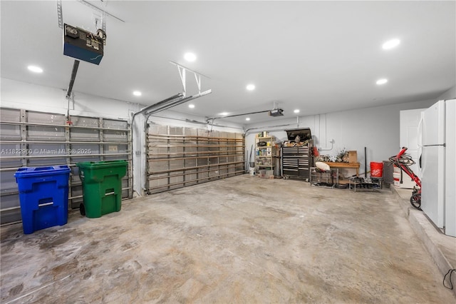 2631 SW 180th Ave, Miramar, FL 33029 - garage featuring freestanding refrigerator, a garage door opener, and recessed lighting