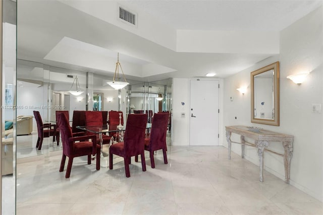 19667 Turnberry Way Unit 6-A, Aventura, FL 33180 - dining space featuring baseboards and a raised ceiling