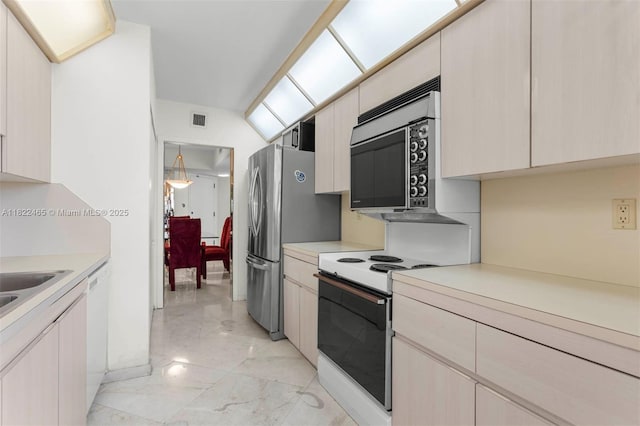 19667 Turnberry Way Unit 6-A, Aventura, FL 33180 - kitchen featuring stainless steel appliances, light marble finish flooring, and light countertops