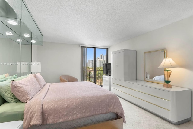 19667 Turnberry Way Unit 6-A, Aventura, FL 33180 - bedroom with a textured ceiling and carpet flooring
