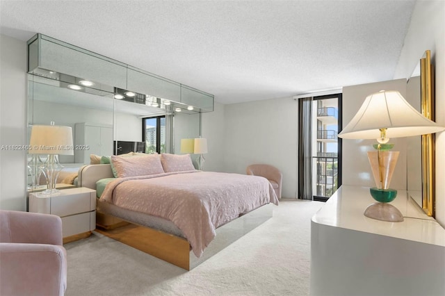 19667 Turnberry Way Unit 6-A, Aventura, FL 33180 - carpeted bedroom with a textured ceiling and access to exterior
