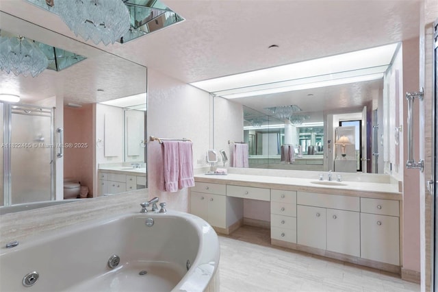 19667 Turnberry Way Unit 6-A, Aventura, FL 33180 - bathroom featuring a stall shower, a tub with jets, and vanity