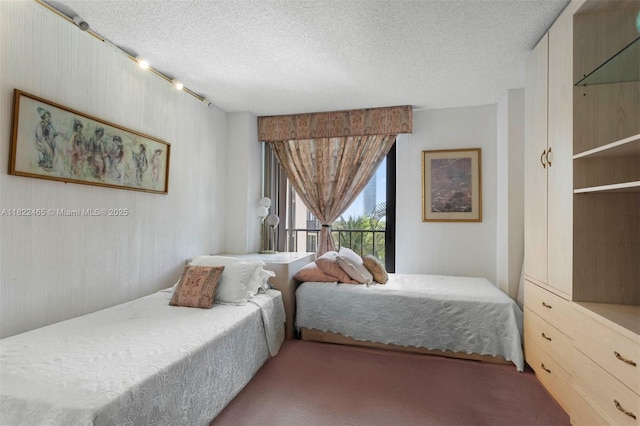 19667 Turnberry Way Unit 6-A, Aventura, FL 33180 - carpeted bedroom featuring a textured ceiling