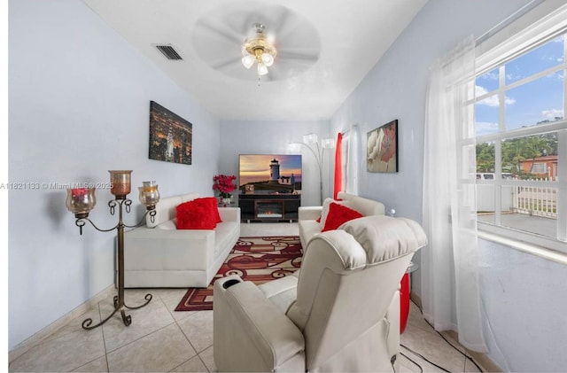 611 E 48th St, Hialeah, FL 33013 - living room with a ceiling fan and tile patterned floors