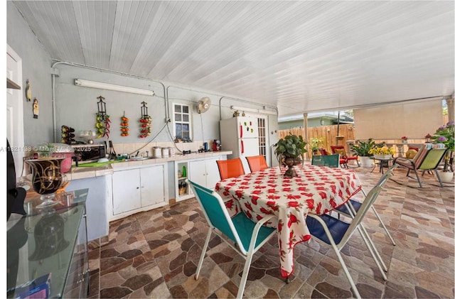 611 E 48th St, Hialeah, FL 33013 - view of patio with outdoor dining area and a sink