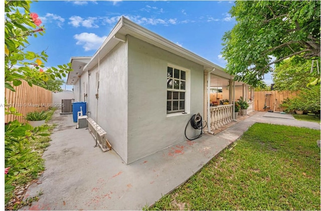 611 E 48th St, Hialeah, FL 33013 - view of home's exterior with stucco siding and a patio