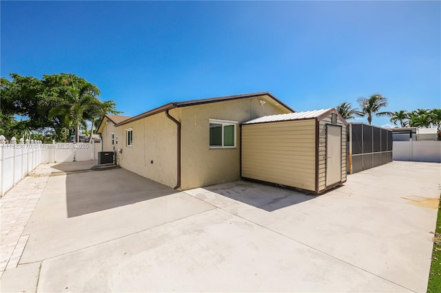 8801 NW 5th St, Pembroke Pines, FL 33024 - back of property featuring a patio, stucco siding, and a fenced backyard