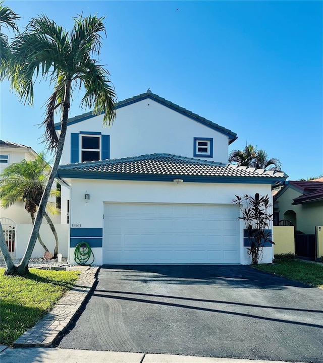 18961 NW 22nd St, Pembroke Pines, FL 33029 - mediterranean / spanish-style house featuring driveway, a tile roof, stucco siding, and a garage