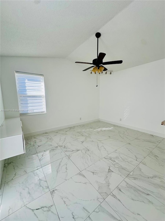 18961 NW 22nd St, Pembroke Pines, FL 33029 - spare room with a ceiling fan, marble finish floors, a textured ceiling, and lofted ceiling