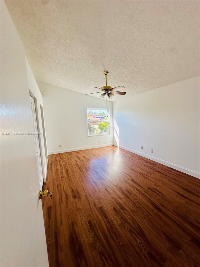 18961 NW 22nd St, Pembroke Pines, FL 33029 - spare room with a textured ceiling, ceiling fan, and wood finished floors
