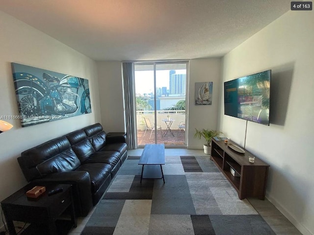 275 NE 18th St Unit 402, Miami, FL 33132 - living area with expansive windows and wood finished floors