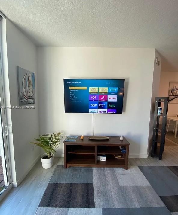 275 NE 18th St Unit 402, Miami, FL 33132 - living room with a textured ceiling and wood finished floors