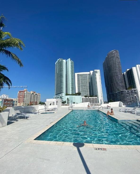 275 NE 18th St Unit 402, Miami, FL 33132 - community pool with a view of city and a patio