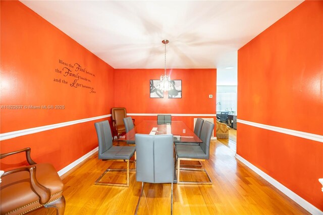 11351 NW 37th St, Coral Springs, FL 33065 - dining room featuring wood finished floors and a chandelier