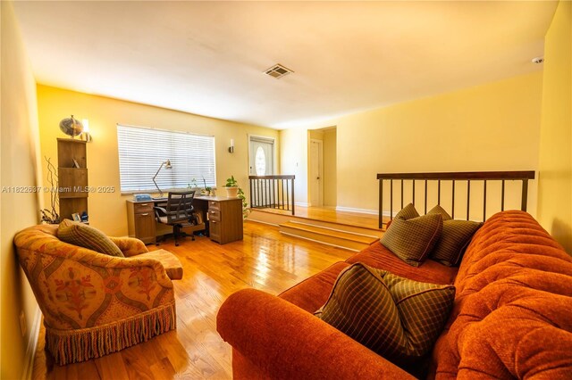 11351 NW 37th St, Coral Springs, FL 33065 - living area with a desk and wood finished floors