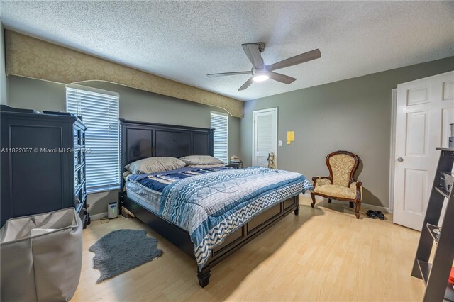 11351 NW 37th St, Coral Springs, FL 33065 - bedroom with wood finished floors, a textured ceiling, and ceiling fan