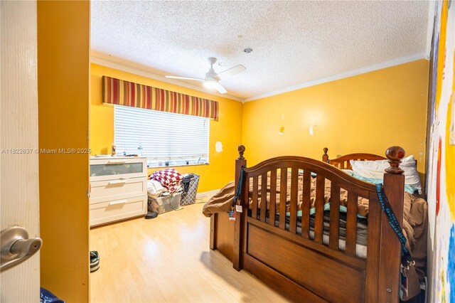 11351 NW 37th St, Coral Springs, FL 33065 - bedroom featuring wood finished floors, crown molding, a textured ceiling, and ceiling fan