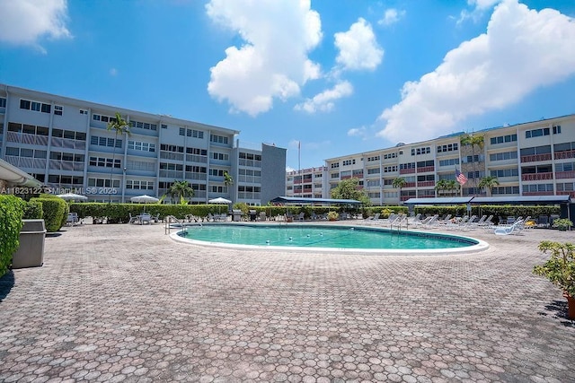 215 SE 3rd Ave Unit 405C, Hallandale Beach, FL 33009 - community pool featuring a patio area