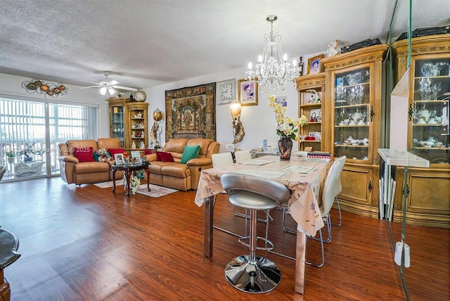 215 SE 3rd Ave Unit 405C, Hallandale Beach, FL 33009 - dining area featuring wood finished floors, ceiling fan, a textured ceiling, and a chandelier