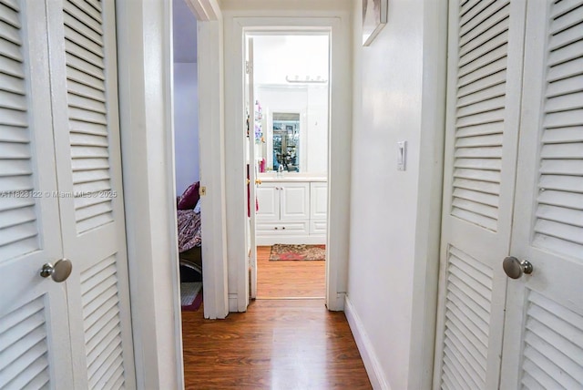 215 SE 3rd Ave Unit 405C, Hallandale Beach, FL 33009 - corridor featuring dark wood-type flooring and baseboards