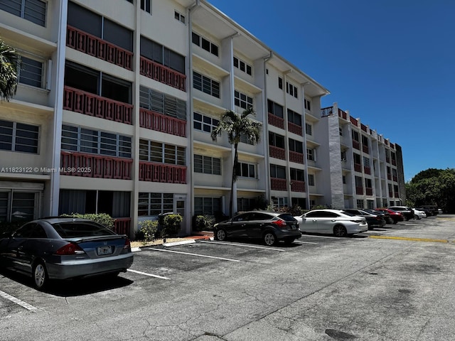 215 SE 3rd Ave Unit 405C, Hallandale Beach, FL 33009 - view of apartment building / complex with uncovered parking