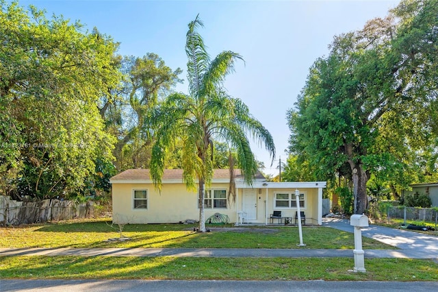 114 Marion Rd, West Park, FL 33023 - ranch-style home with driveway, stucco siding, and a porch