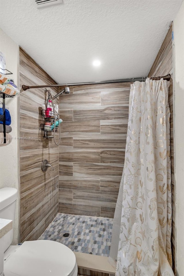 114 Marion Rd, West Park, FL 33023 - full bath with tiled shower and a textured ceiling