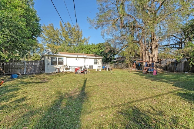 114 Marion Rd, West Park, FL 33023 - fenced backyard with a playground