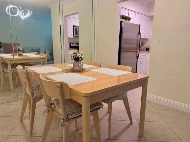 3801 NE 22nd Ter Unit 7, Lighthouse Point, FL 33064 - dining room with light tile patterned floors and baseboards
