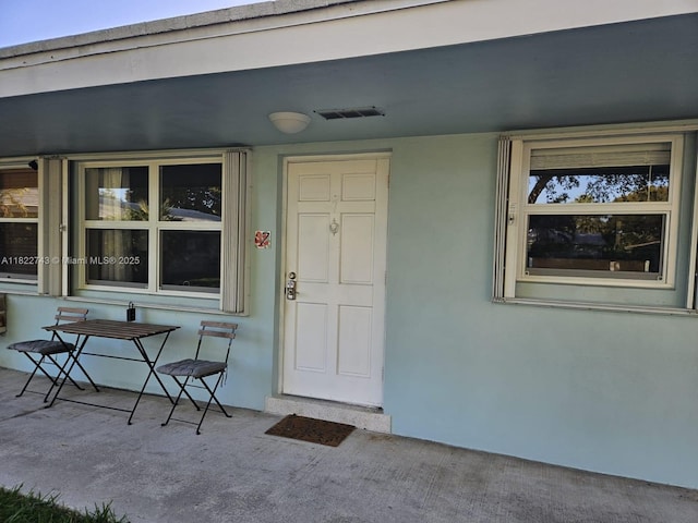 3801 NE 22nd Ter Unit 7, Lighthouse Point, FL 33064 - property entrance featuring stucco siding and a porch