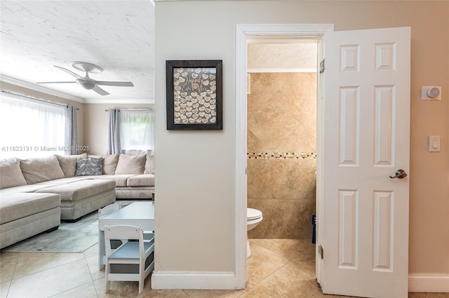6797 SW 40th St Unit 71, Davie, FL 33314 - living room with light tile patterned floors, ceiling fan, and ornamental molding